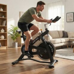 man on Bolt SC2 Spin Bike in a living room