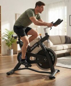 man on Bolt SC2 Spin Bike in a living room