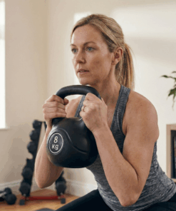 Puls8 Vinyl Kettlebell with Woman